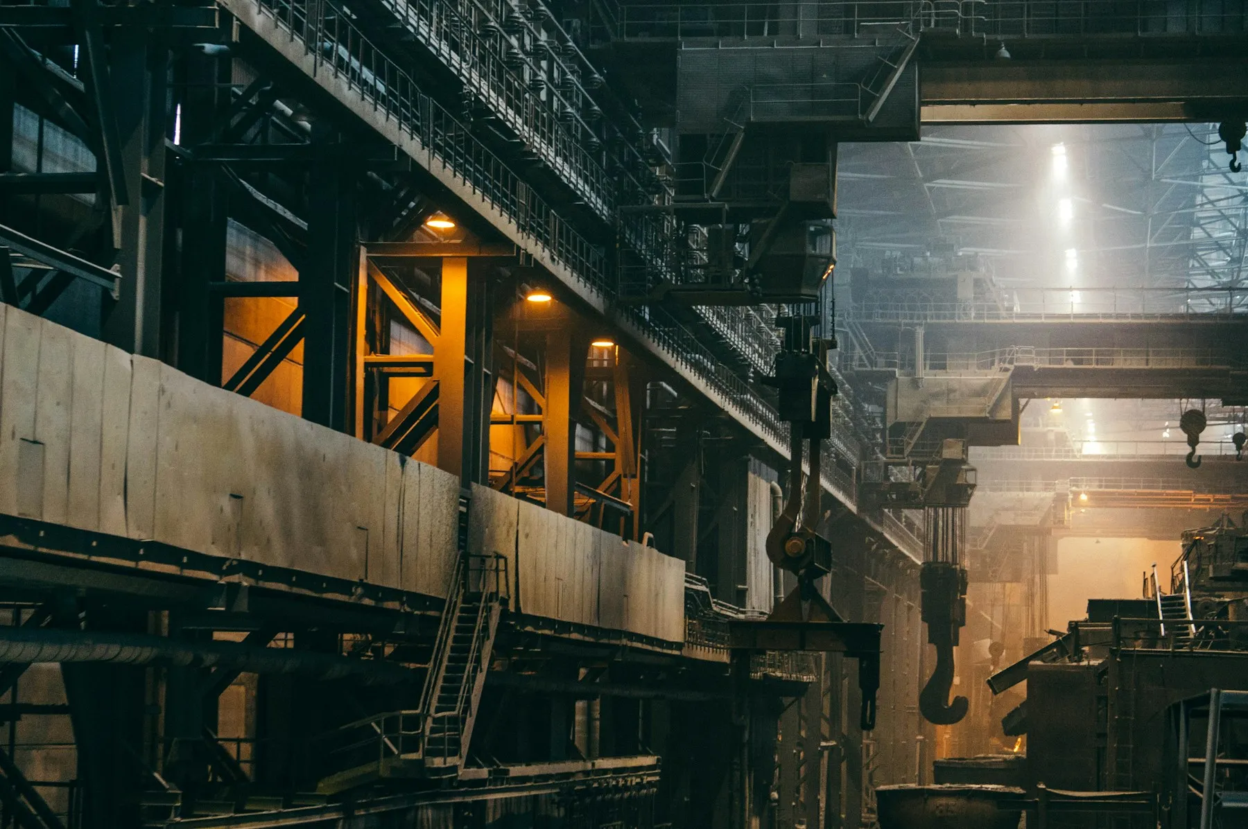Steel production hall with overhead industrial equipment