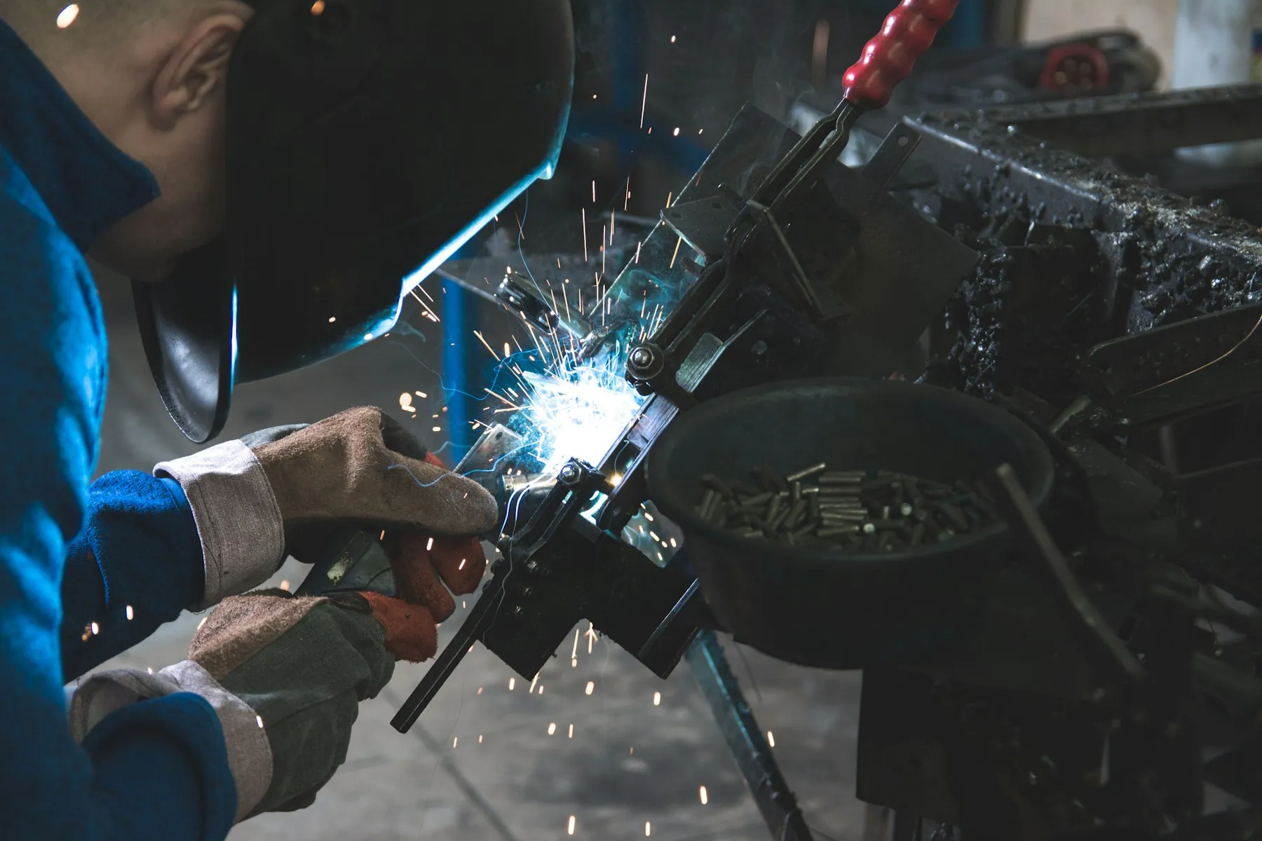 Metalworking and welding detail inside an industrial workshop